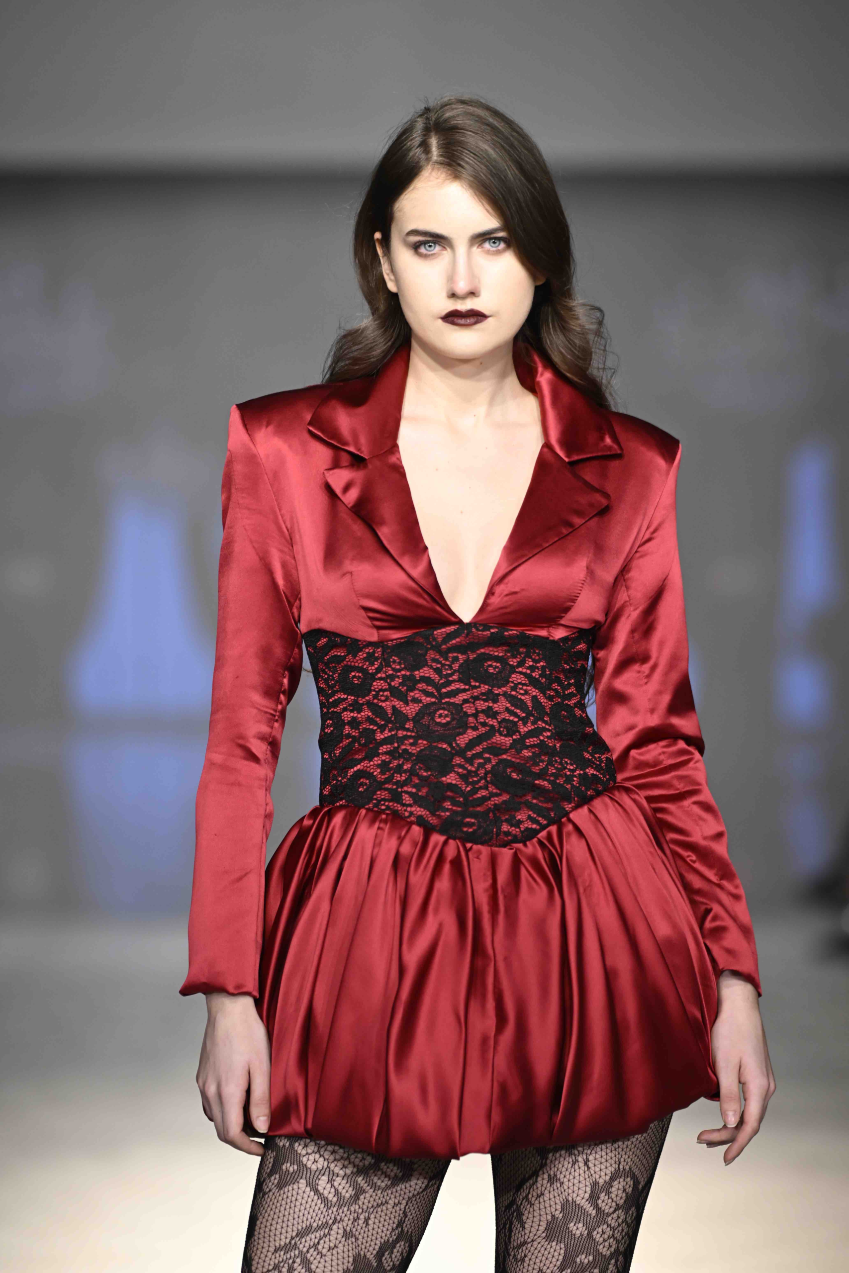 Sculpted shoulder and corsetry detail from the FASTIGIUM FW26 runway
