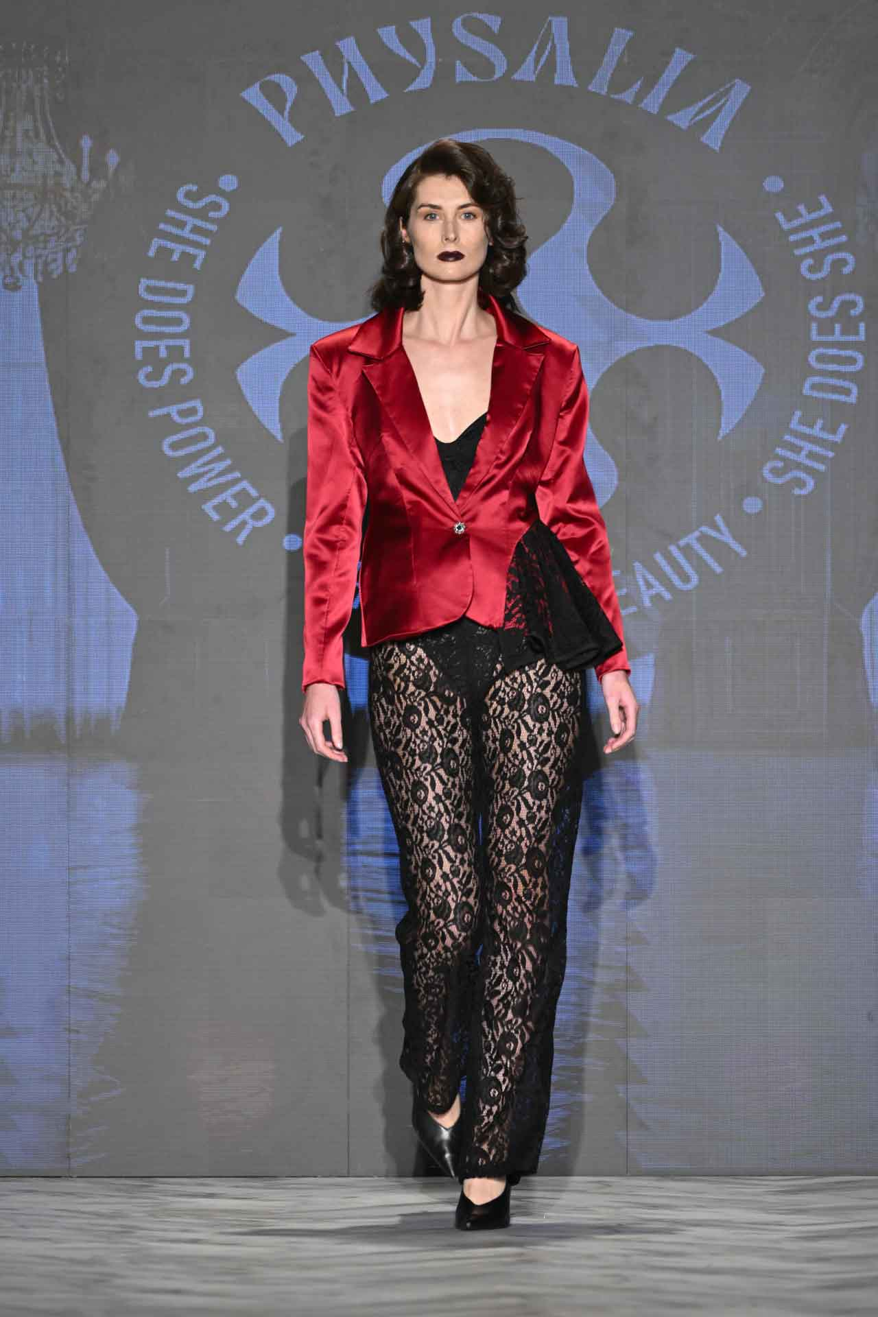 Physalia Look 7 — red silk blazer with black lace side peplum and sheer black lace wide-leg trousers