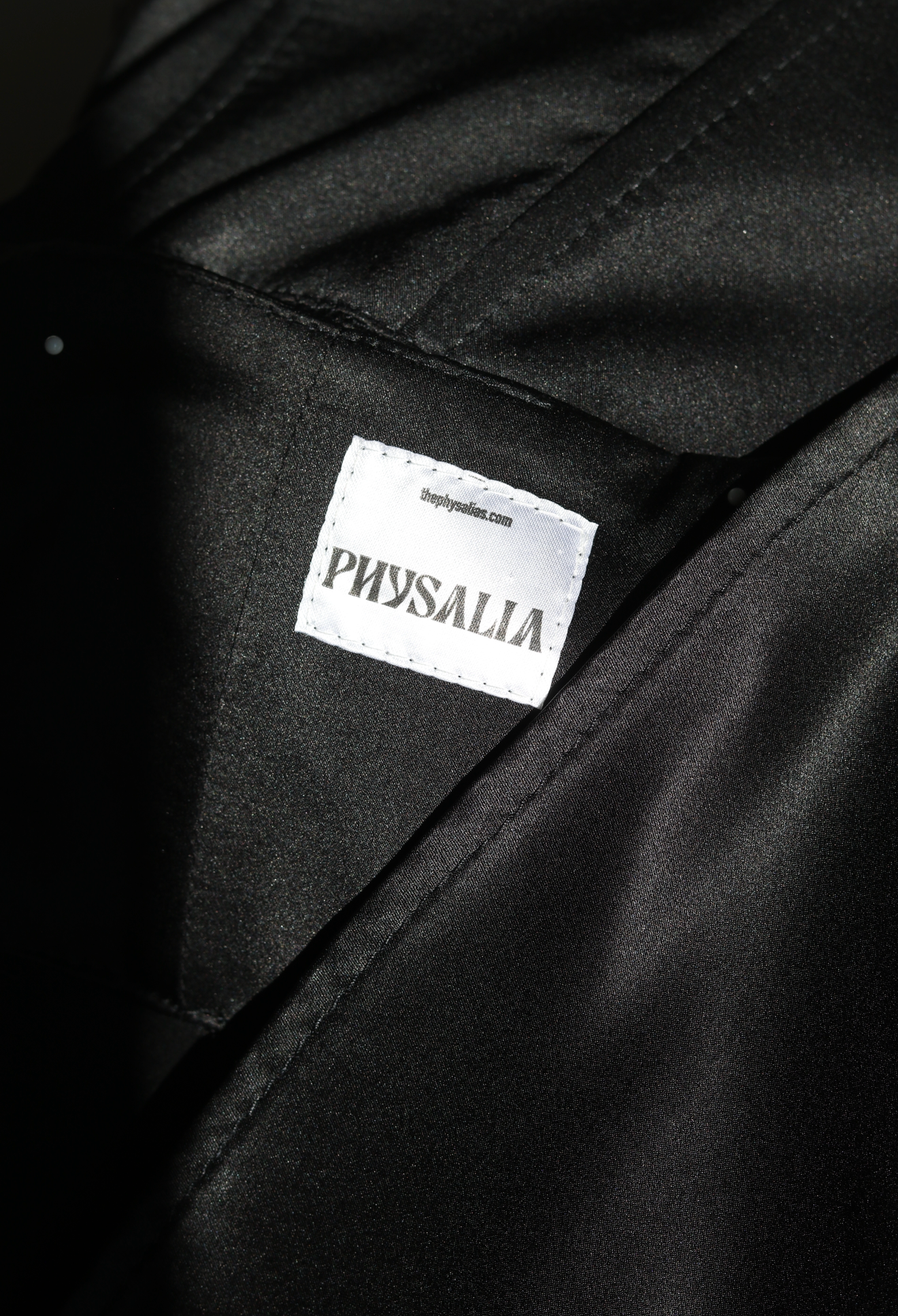 Interior construction and label detail of a Physalia womenswear garment