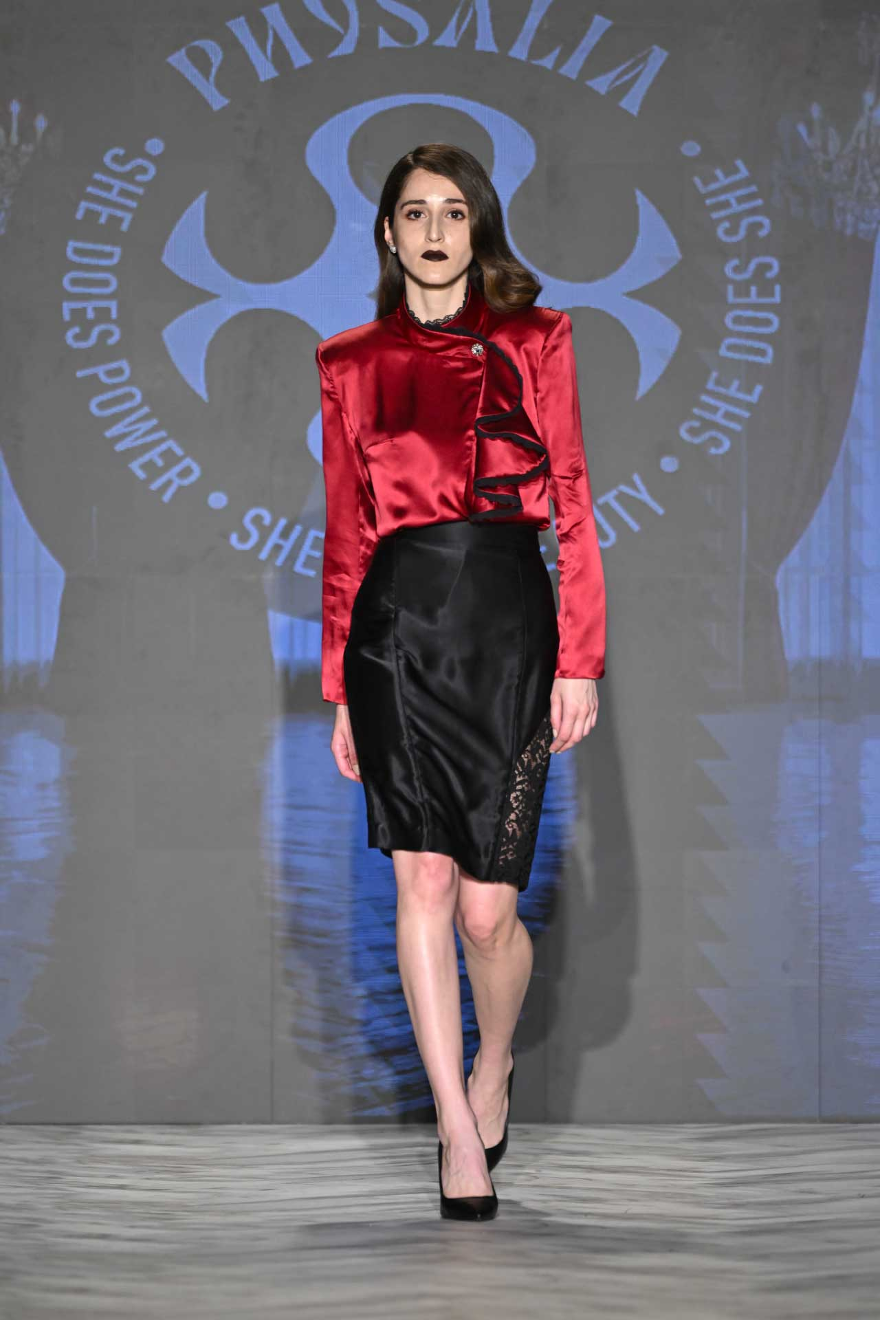 Physalia FASTIGIUM FW2026 Look 5 — red silk blouse with asymmetrical ruffle and black silk pencil skirt with side lace insert