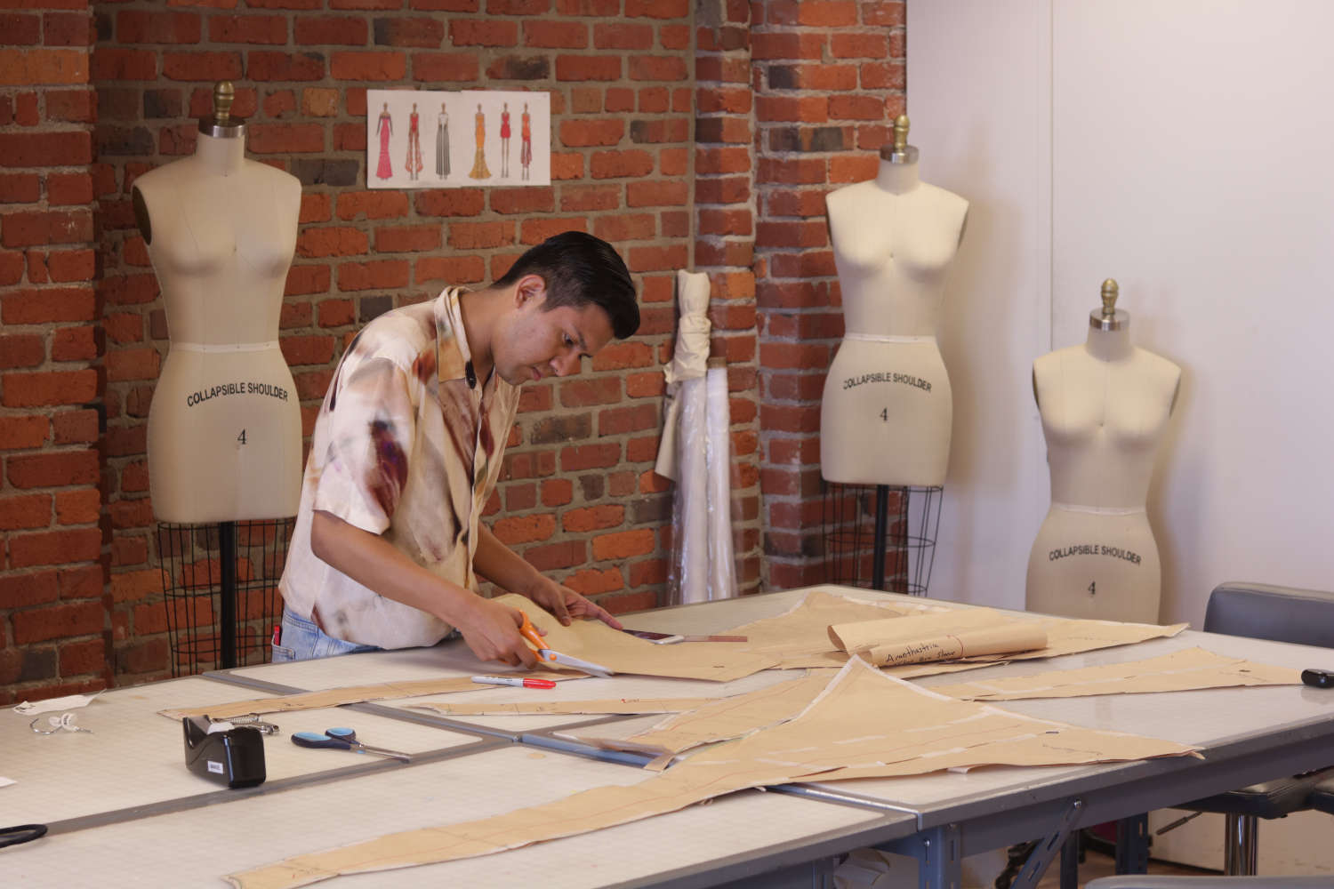 Physalia designer developing patterns and luxury womenswear construction in studio