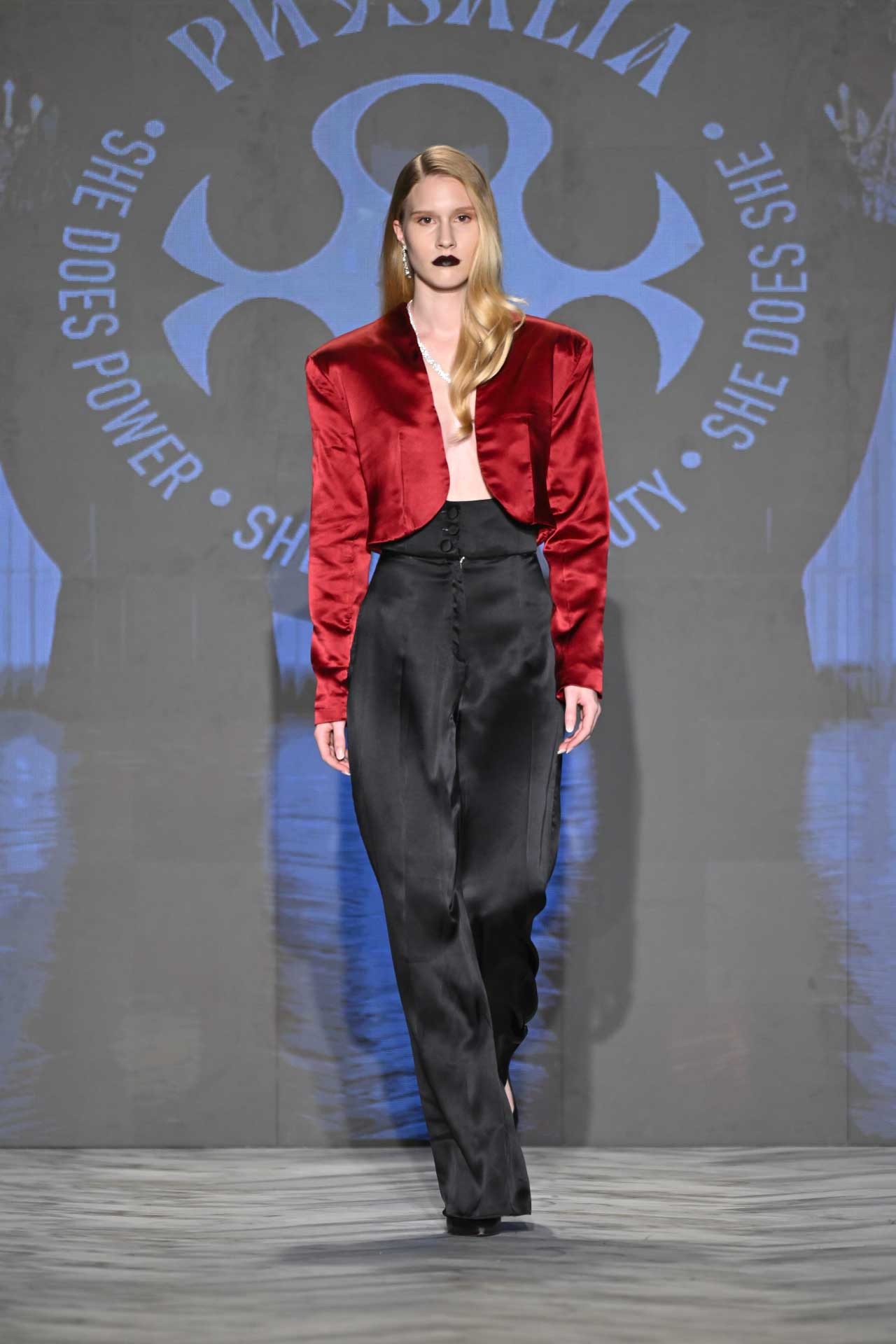 Physalia FASTIGIUM FW2026 Look 6 — cropped red silk bolero jacket and high-waisted wide-leg black silk trousers