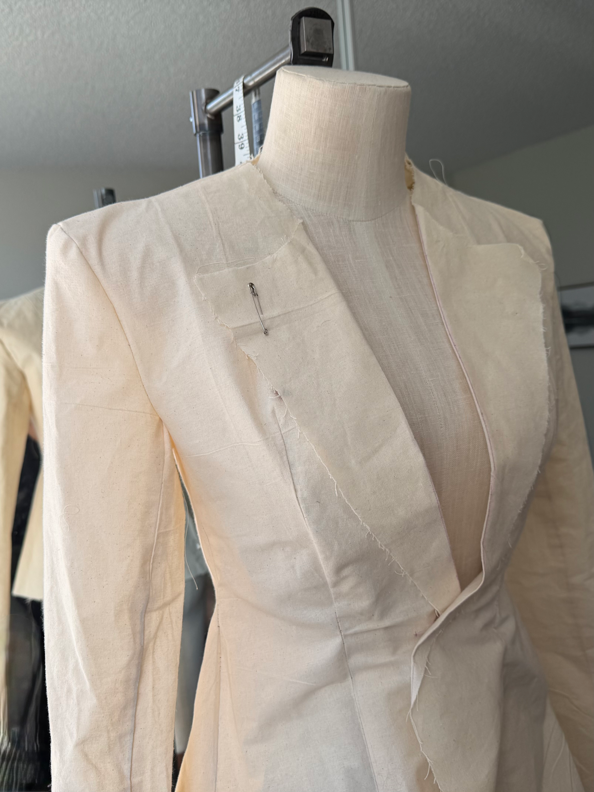 Muslin prototype sample for a Physalia luxury womenswear garment on a dress form